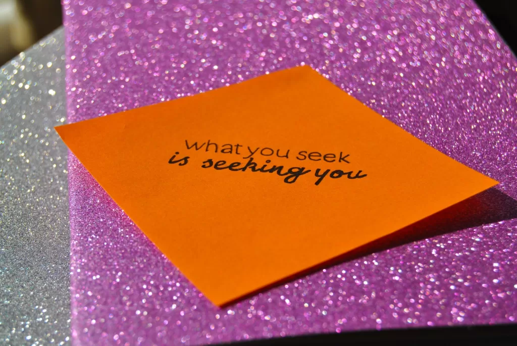 a yellow and orange paper with black text on it.